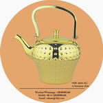 gold tea pot with hammer dots